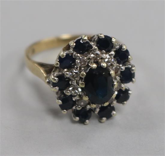 A 1970s 9ct gold, sapphire and diamond cluster dress ring, size L.